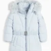 Quilted jacket with hood and faux fur trim light blue