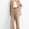 Business trousers - mid-rise waist - wide leg beige