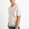 Knitted polo shirt - regular fit - patterned light beige